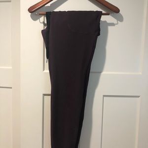 Zyia active wear track pants in deep plum purple.